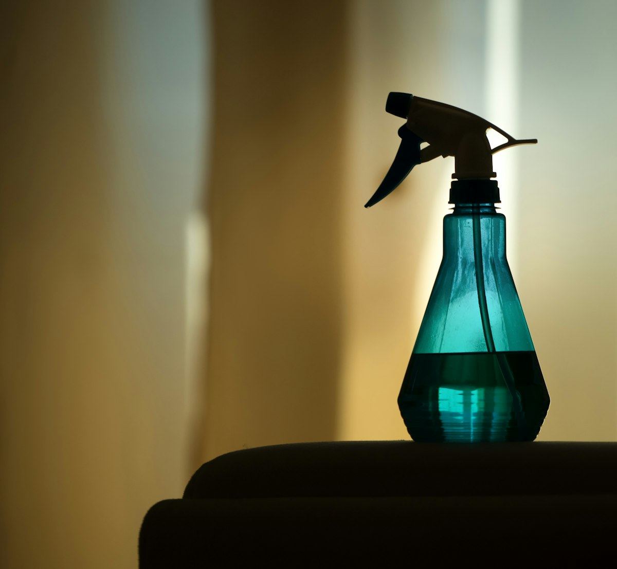 A spray bottle on a surface ready for use