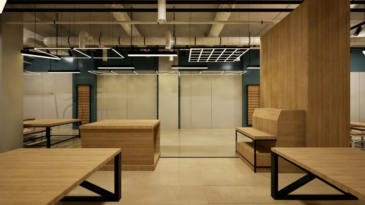An empty modern room with wooden furniture and concrete walls