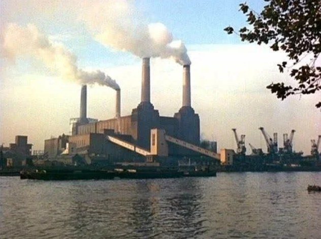 Battersea Power Station and its four chimneys beside the Thames, in an archive photograph