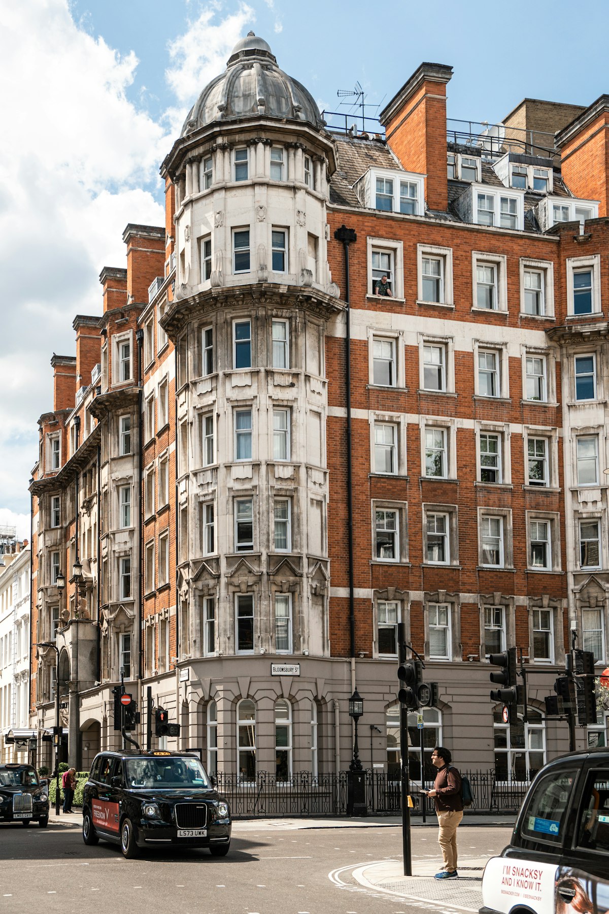 A red-brick Edwardian corner building on a Bloomsbury street