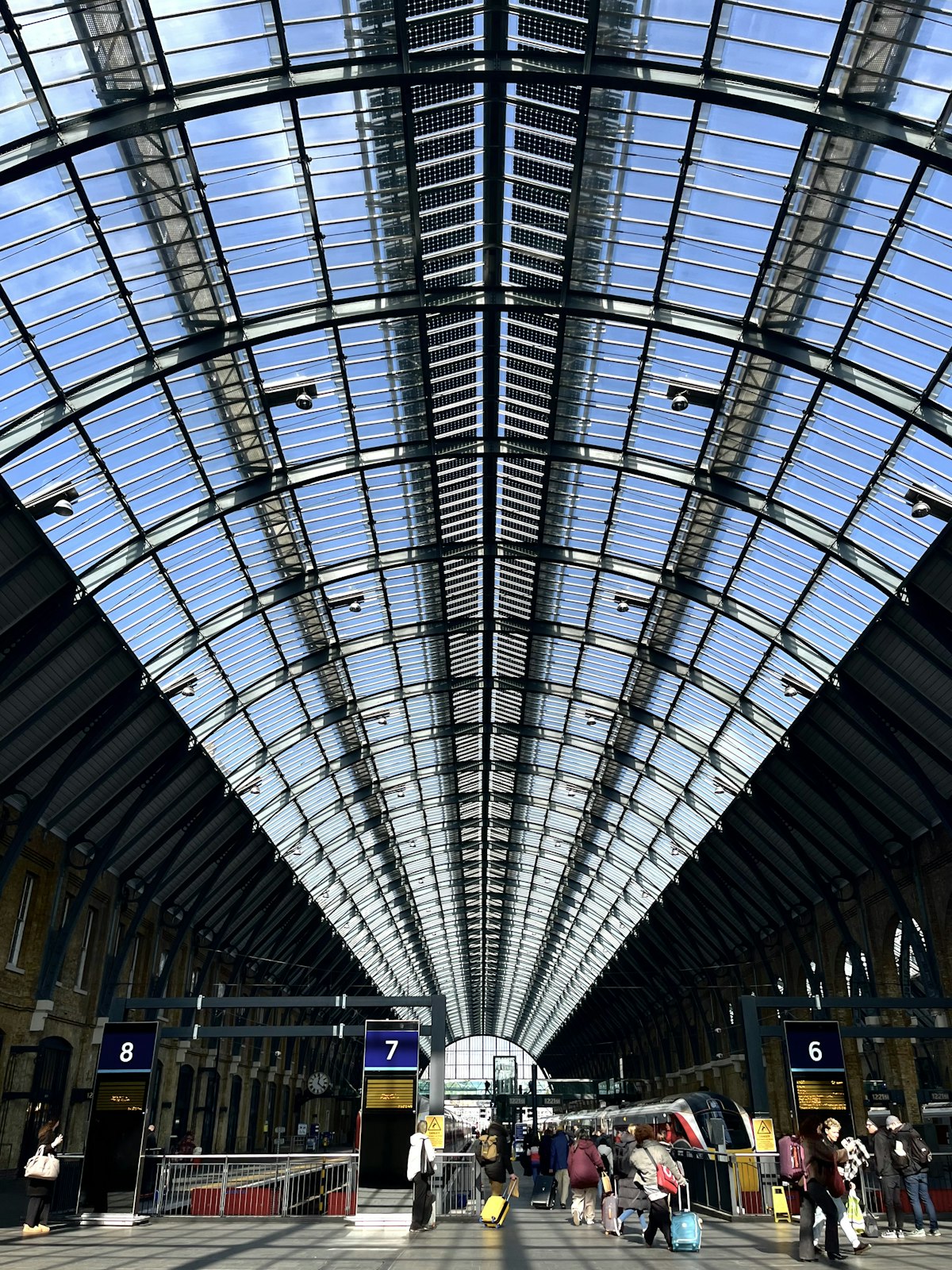 The glass and steel roof of the concourse at King’s Cross station