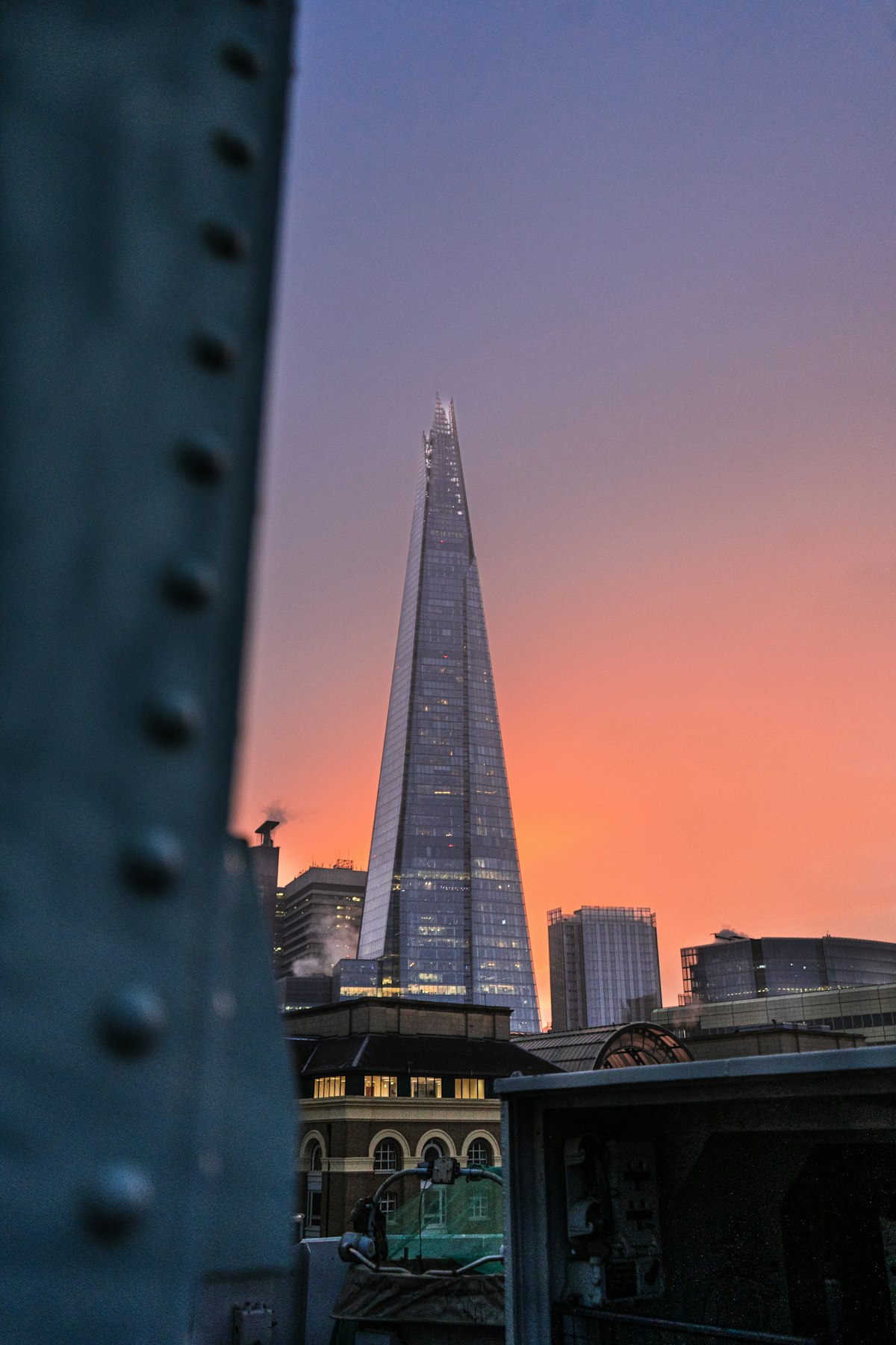 The Shard rising above London Bridge at sunset