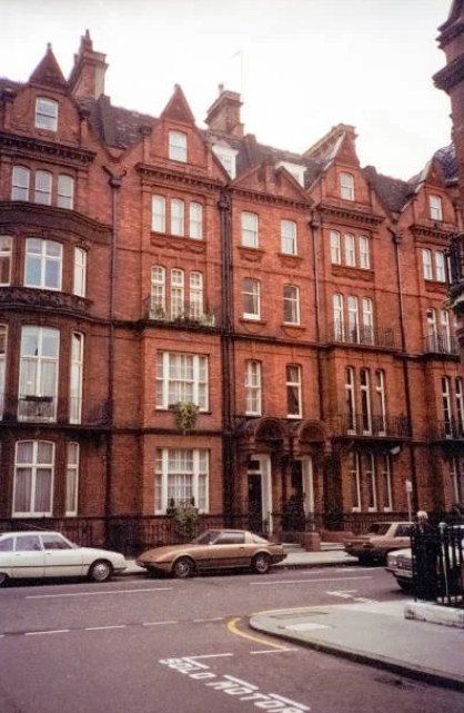 A red-brick Victorian mansion block on a Mayfair street, in an archive photograph