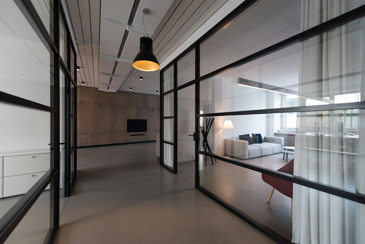 A bright office with glass partitions and soft daylight, the kind of Bloomsbury workplace we clean