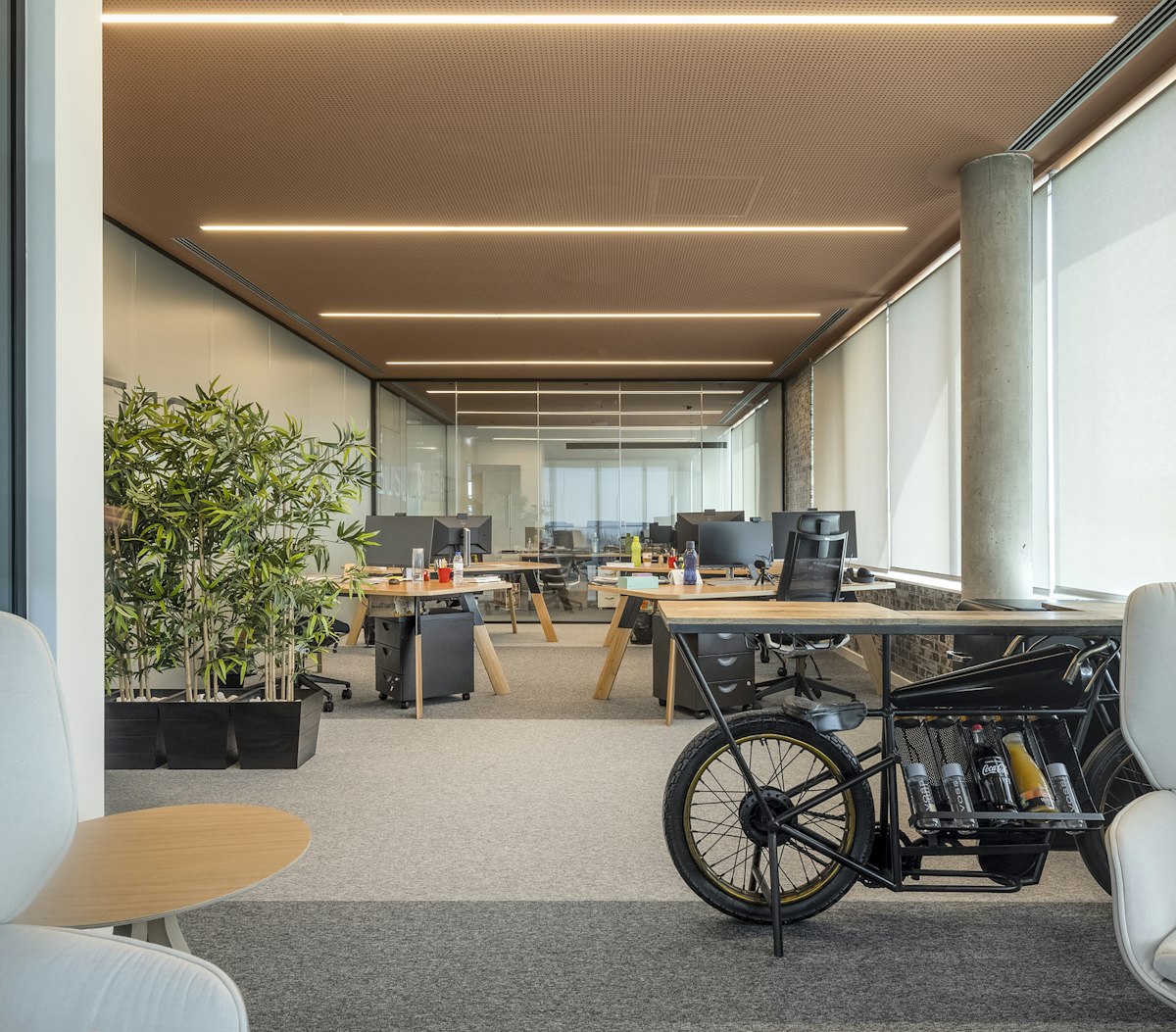 A design-led office with a bike parked beside desks and plants, the kind of Clerkenwell workplace we clean