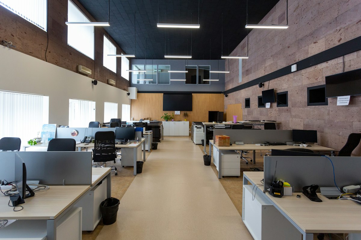 A large open-plan office with rows of desks under linear lighting, the kind of King’s Cross workplace we clean
